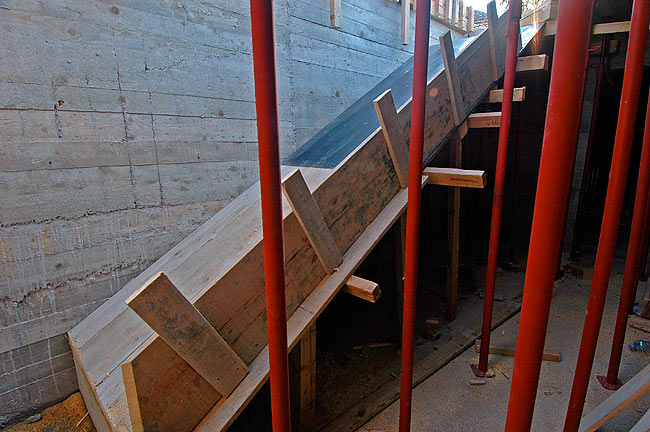 Wooden ramp to cast the bottom of the stairs