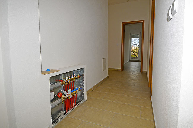 Corridor and underfloor heating cabinet of one apartment in Amadeo II