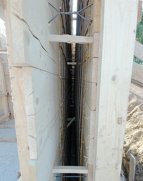 Close-up inside the wooden structure of the armed concrete wall