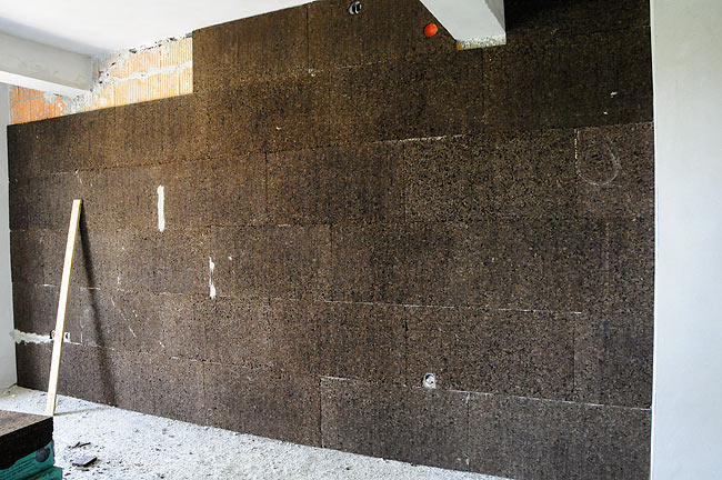 Cork boards being installed on the wall in Amadeo II - 2