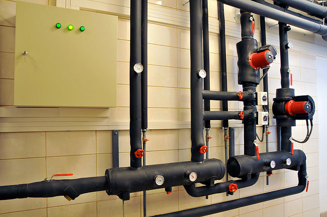 Distribution side of the geothermal system with circulation pumps and mixing valves in Amadeo